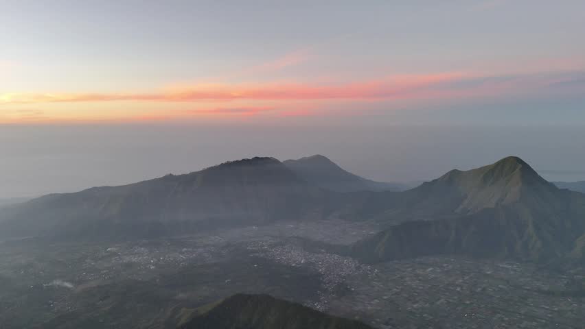 Majestic Mountain Range and Valley Town at Dawn