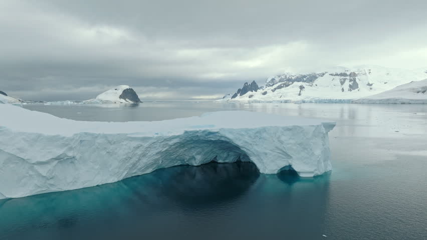 Drone View of Iceberg Arch in Antarctica
