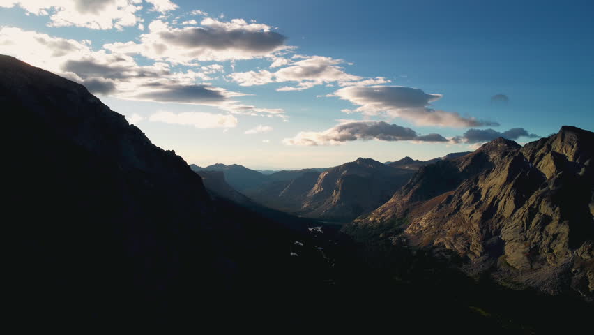 Aerial drone footage of the Wind River Range in Wyoming along the Continental Divide Trail corridor, showcasing jagged alpine peaks, glacial valleys, and pristine high-altitude wilderness.