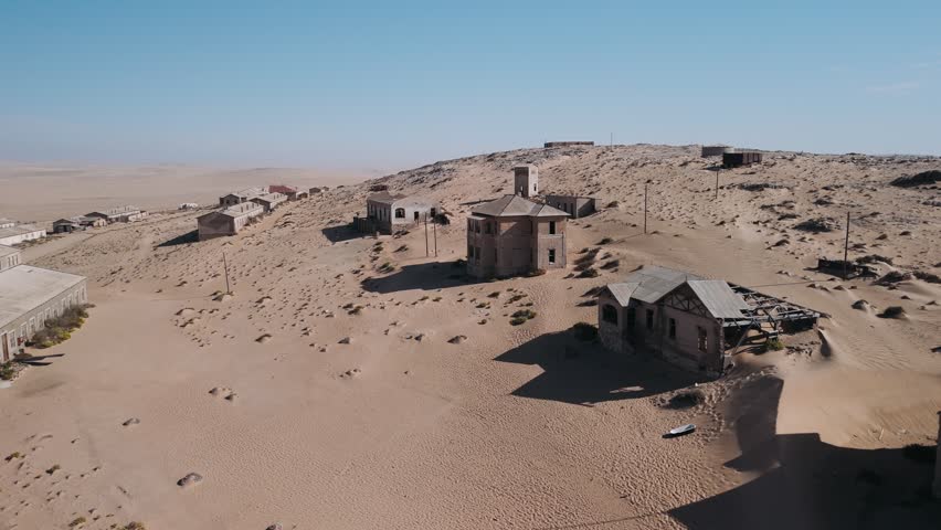 Aerial view of the kolmanskop ghost town in namibia, an abandoned diamond mining settlement in the namib desert.