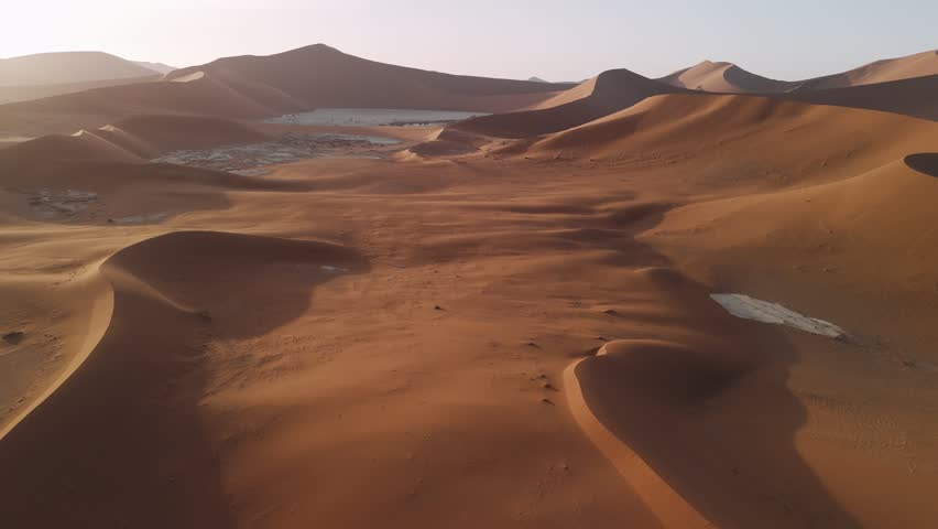 Aerial view of sossusvlei sand dunes in the namib desert during a sunrise in namibia, africa.