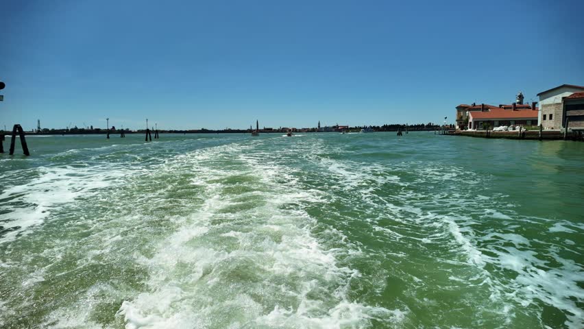 View of a boat passing through the waterway on the Venice to Burano route.