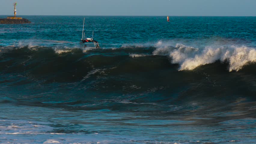 waves breaking on the beach in Newport