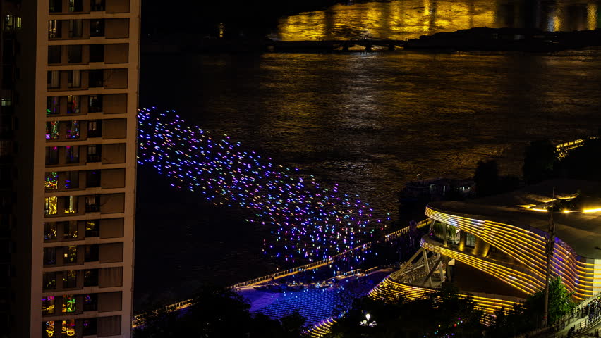 CHONGQING, CHINA - 28 MAY 2026: the amazing drone light show over the skyline of Chongqing cyberpunk city with the drones coming home to land