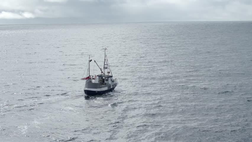 Small fishing boat on calm open sea