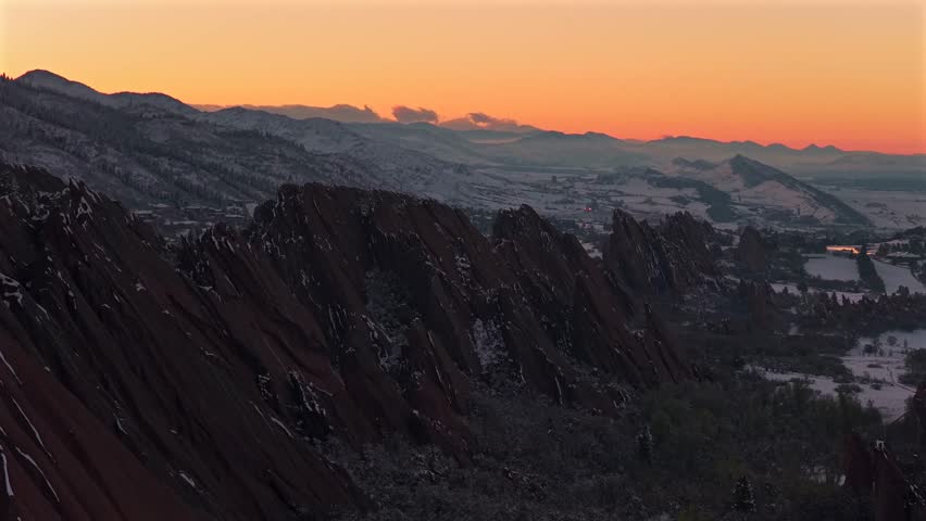 Snow-covered dusk sunset Roxborough State Park Fountain Valley Trail jagged red rocks sandstone Littleton Sterling Ranch Colorado aerial drone landscape Denver Front Range Rocky Mountains forward