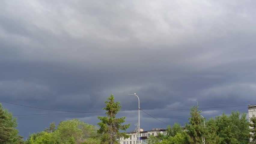 Dark clouds in the sky before the rain. Cloudy weather, storm