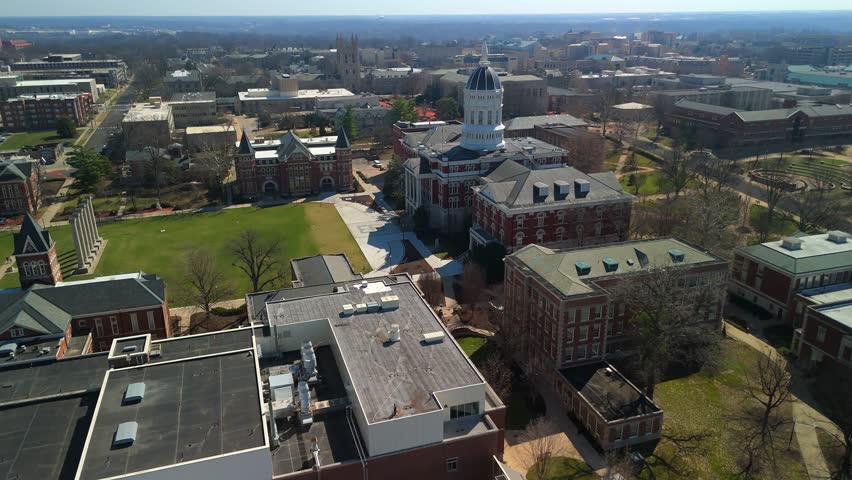 Jesse Hall dome beside University of Missouri campus skyline