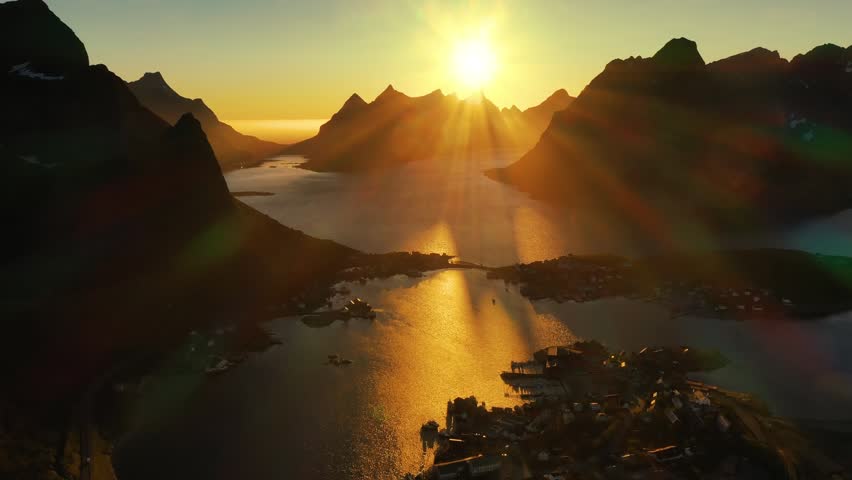 Drone footage capturing a serene Norwegian village at sunset.