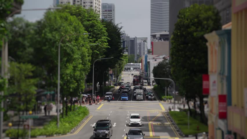 Busy city street traffic in downtown singapore