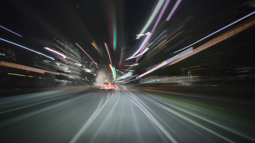 Drivelapse night ride through Tokyo neon metropolis, view from a car windshield, high speed motion-blur highway, beautiful glowing light trails, traffic and skyscrapers time-lapse footage.
