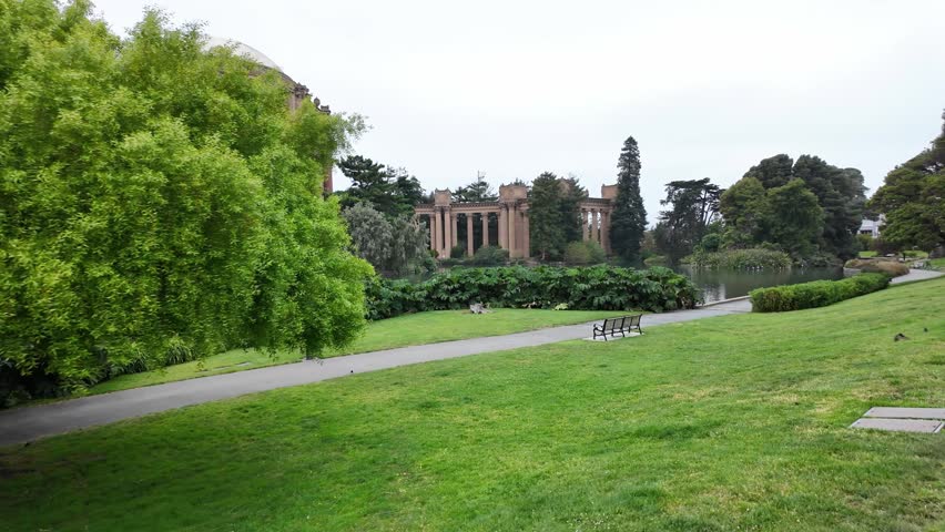 Scenic point of view of the monumental Palace of Fine Arts, a historic landmark in San Francisco, California, with its rotunda and colonnades reflecting on the tranquil lagoon