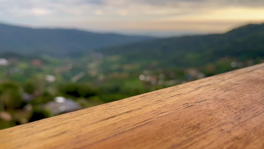 Sunrise in the mountains and wooden table