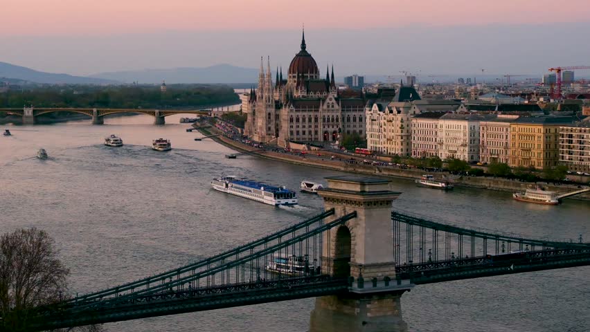 Step into the enchanting ambiance of Budapest as the sun sets, casting beautiful hues over the Danube River. Marvel at the iconic landmarks and the serene atmosphere.