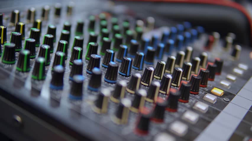 Professional audio mixer control panel for music production or broadcasting in a recording studio