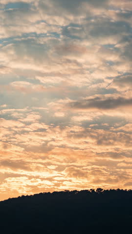Beautiful evening clouds time-lapse, soft purple and pink sky background.