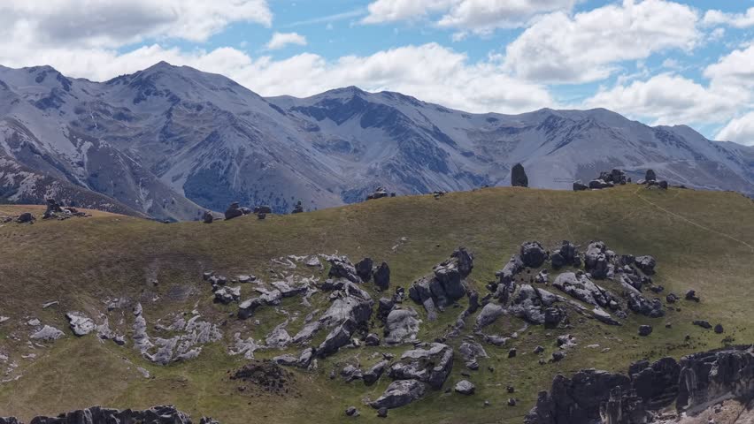 Drone aerial over rugged alpine terrain and mountain ranges on New Zealand