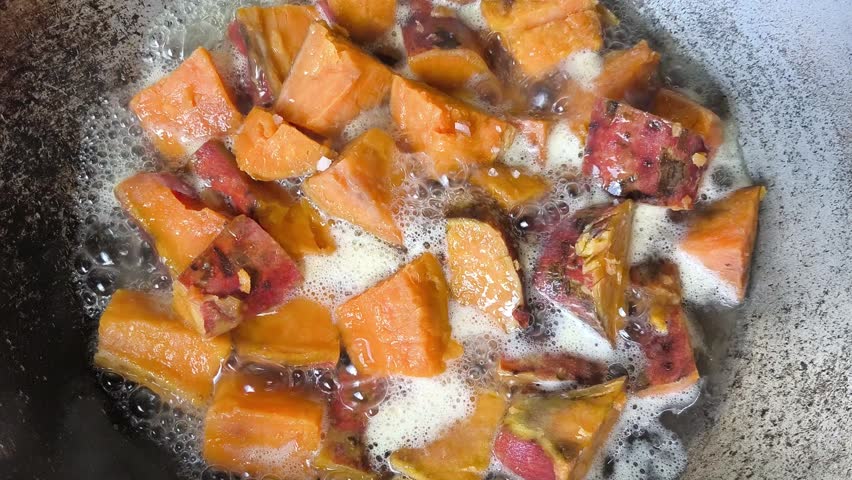Boiling sweet potatoes in pan, indoor Chiangmai Thailand.