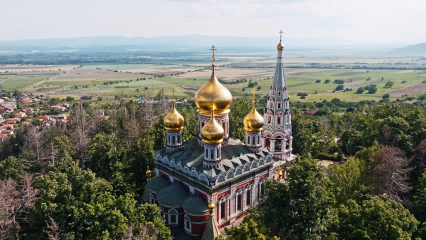 Shipka Memorial Church golden domes aerial drone Bulgaria slow motion Orthodox landmark travel tourism Rose Valley Kazanlak heritage architecture religion Balkans