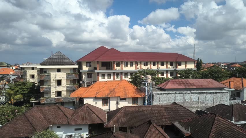 Residential panorama under bright cloudy sky