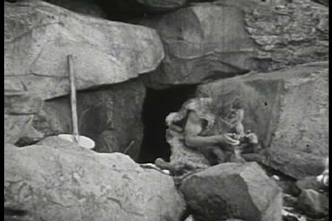 1930s - Funny footage of cavemen being scared by wild animals.