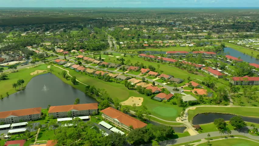 Beautiful aerial video of Naples, Florida, USA featuring scenic coastal landscapes, luxury waterfront neighborhoods, lush greenery, and stunning urban views. Cinematic drone footage showcasing the beauty of Southwest Florida in horizontal 4K format.