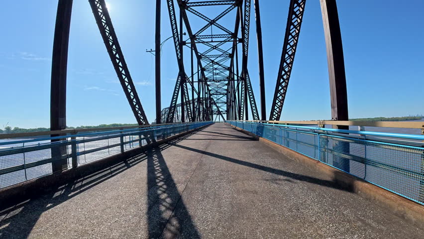 immersive POV cycling across the historic Old Chain of Rocks Bridge (Route 66) over the Mississippi River near St. Louis, Missouri. Scenic ride with sweeping river views, unique bridge design.