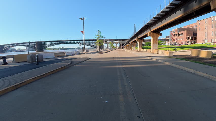 Immersive POV from a bike ride on the St Louis Riverfront trail along the Mississippi River towards Gateway Arch