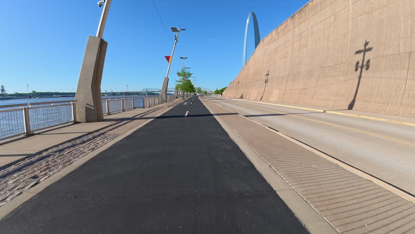 Immersive POV from a bike ride on the St Louis Riverfront trail along the Mississippi River towards Gateway Arch
