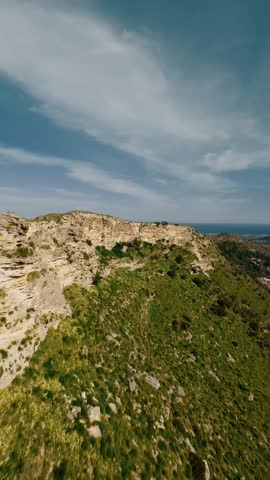 Aerial view of rocky hill and vegetation