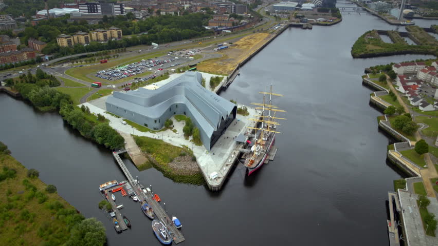 High angle rotating view of the Riverside Museum and the River Clyde in Glasgow, Scotland