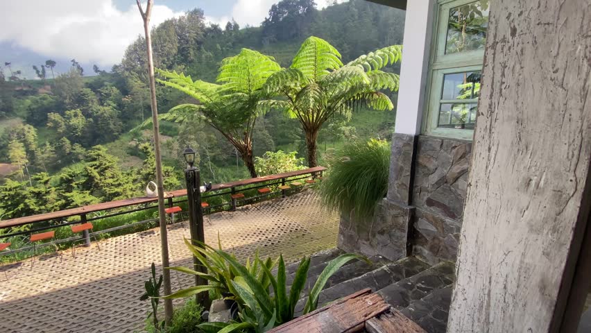 coffee shop with a comfortable home concept showing the slopes of Mount Merapi
