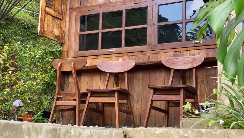 a coffee shop with an aesthetic wooden house concept on a beautiful mountain slope