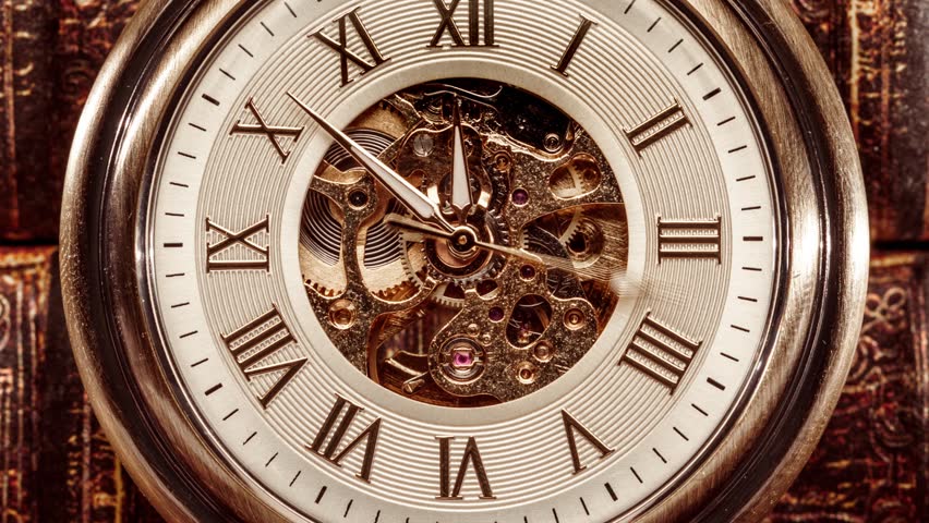 Antique pocket watch mechanism, gears moving, clockwork motion, macro.