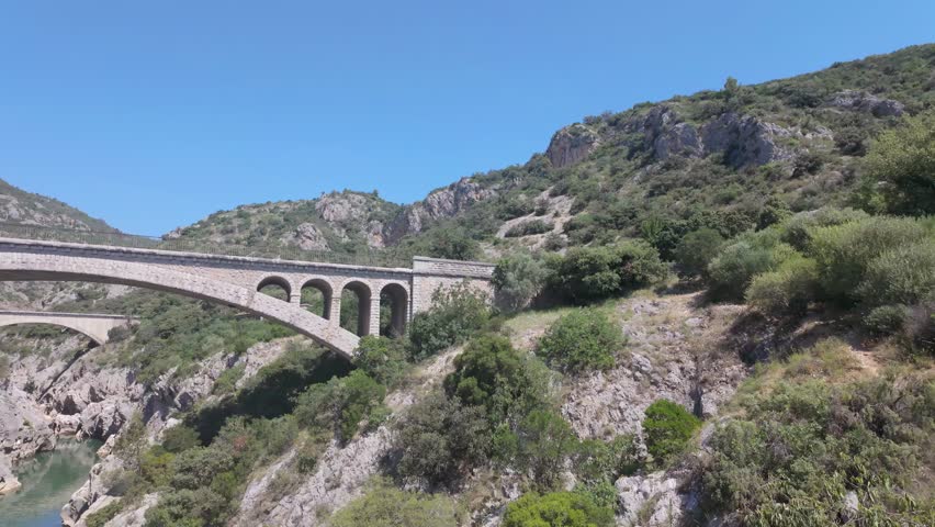 Pont du Diable Bridge Spanning Verdant Gorge in Occitanie, France