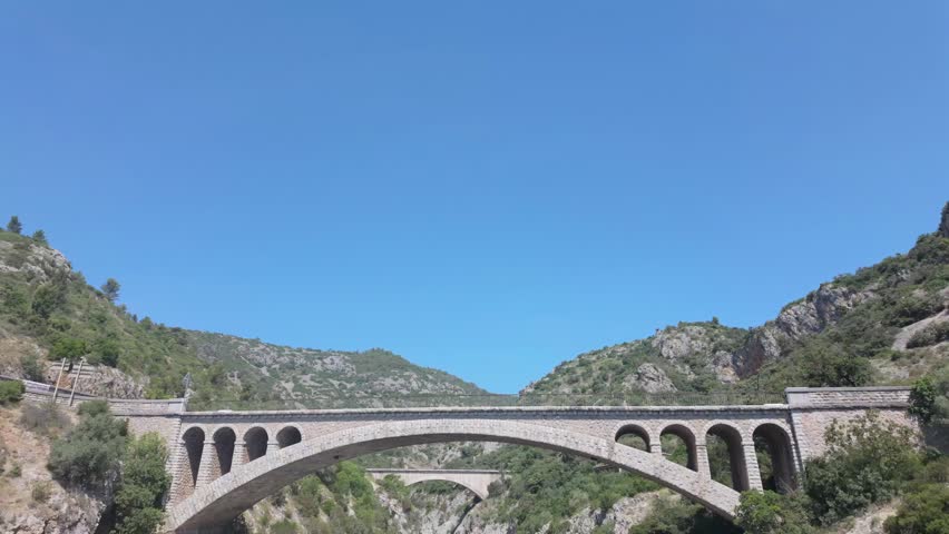 Pont du Diable Bridge Spanning Verdant Gorge in Occitanie, France