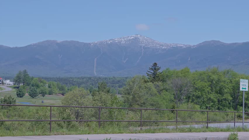 Distant panoramic Mount Washington mountain landscape at White Mountain National Forest with forested valley, Lincoln, New Hampshire, US