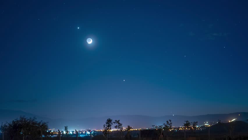 Planetary Conjunction of Crescent Moon, Venus, and Jupiter in Night Sky