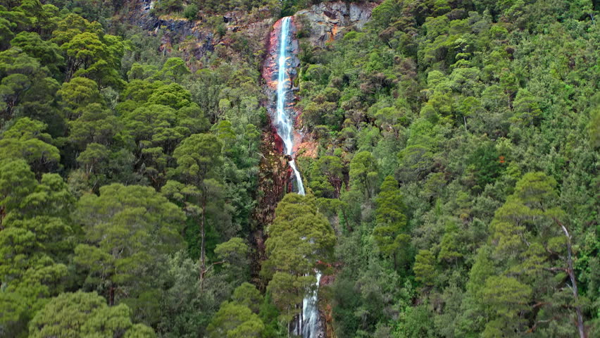 Waterfall mountain landscape. Tasmania travel background aerial view
