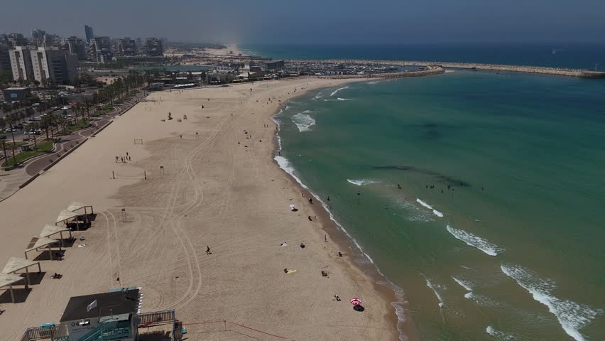 4K Slow Motion Drone Flight South Along Ashdod Coastline, Israel, Sea on the Right and City on the Left, HaKeshet Beach