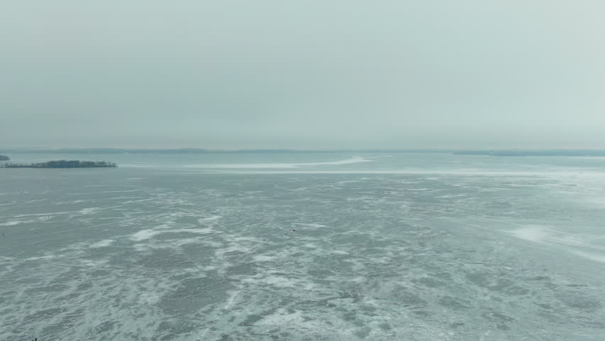 Aerial Forwarding shot of Frozen Lake Mendota in Madison. Wisconsin