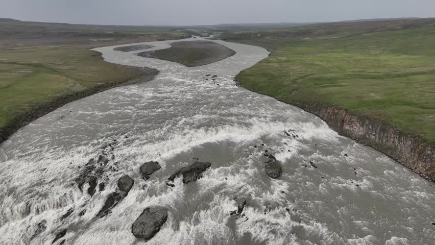 aerial View of Dynkur Waterfall and Meandering River in Iceland Highland Landscape