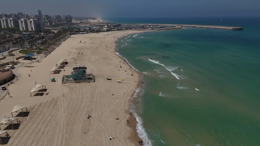 4K Slow Motion Drone Flight South Along Ashdod Coastline, Israel, Sea on the Right and City on the Left, HaKeshet Beach