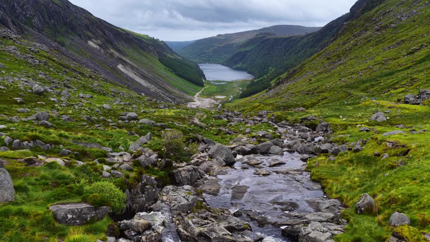 Hiking in Ireland, aerial view of Glendalough valley with a lake and a winding river, Wicklow, Ireland, tourism in Ireland, aerial view of Irish Glendalough 