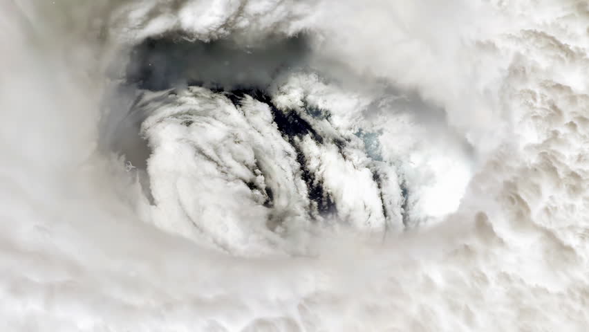 High Angle View Of Plane Flying Near Huge Eye Of A Hurricane - Elements of this Video furnished by NASA - 4K