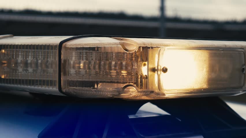Flashing Police Sirens Close Up on a Patrol Car