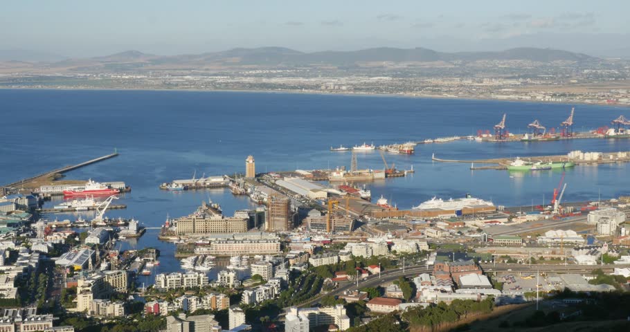 4K footage from Signal Hill overlooking the Victoria and Alfred Waterfront, Cape Town harbour and Table Bay. A spectacular urban and maritime landscape in the Western Cape, South Africa.