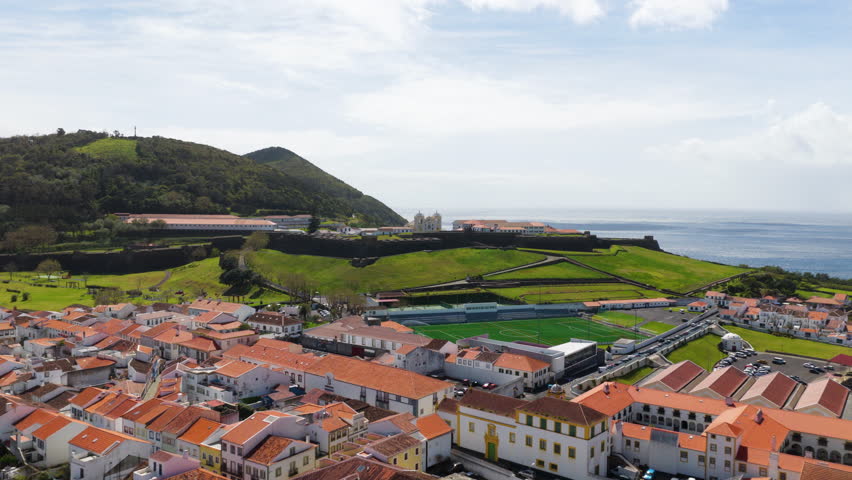 Flying Over City Of Angra Do Heroismo Towards The Historic Fortress Of Saint John The Baptist On Terceira Island, Azores, Portugal. - aerial shot
