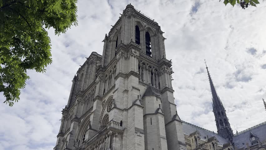 Notre-Dame Cathedral in Paris, France under spring sky