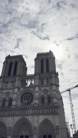 Notre-Dame Cathedral in Paris, France under spring sky